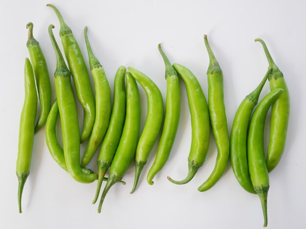 High angle view of green chili pepper against white background