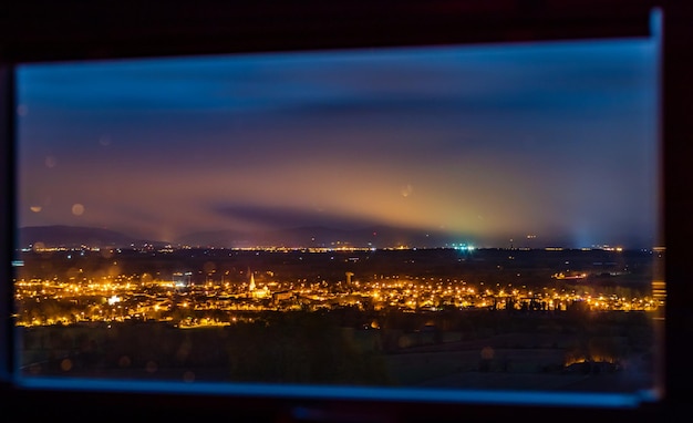 Photo high angle view of illuminated buildings against sky at night