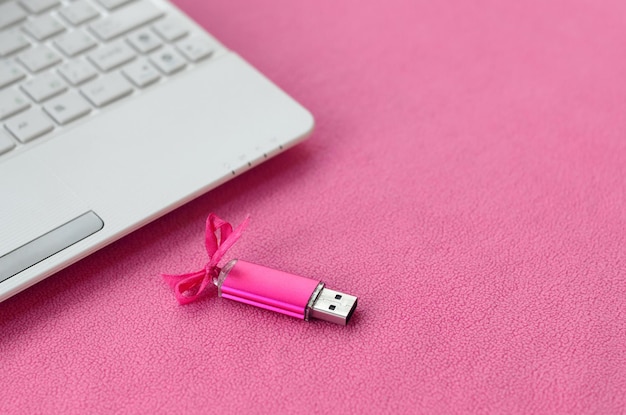 High angle view of laptop and usb stick on table