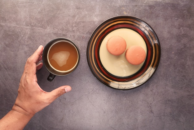 high angle view of man holding coffee cup.