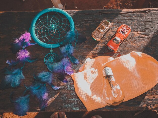 Photo high angle view of multi colored shoes on wooden table