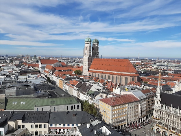 High angle view of old buildings in town against sky