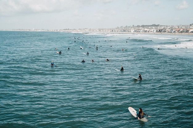 High angle view of people surfing in sea