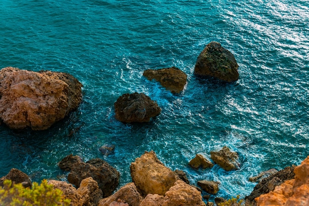 Photo high angle view of rocks in sea