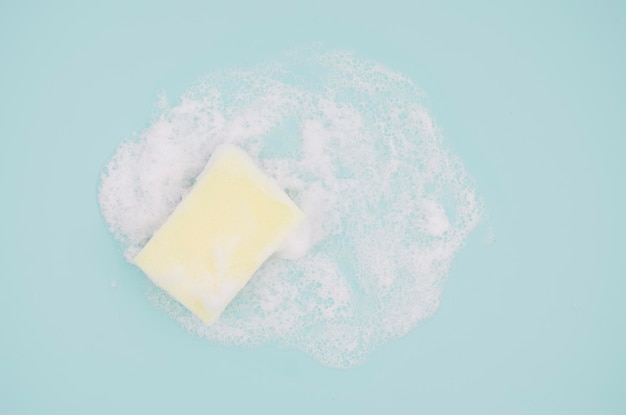 Photo high angle view of soap on blue background