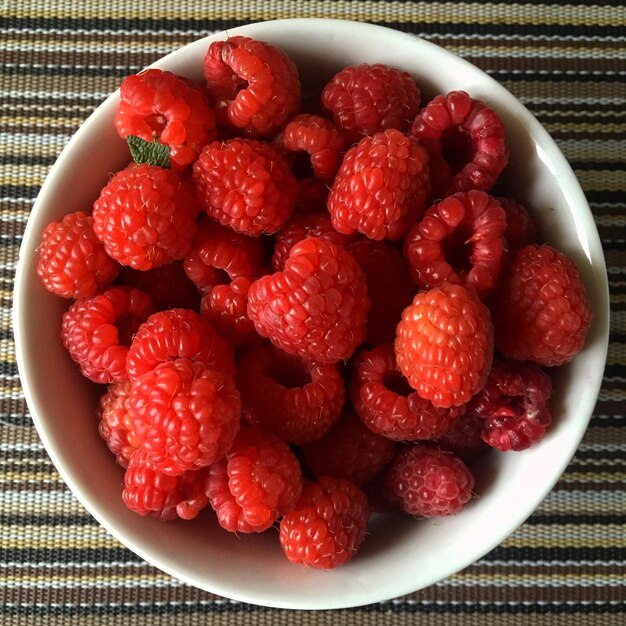 High angle view of strawberries in bowl on table