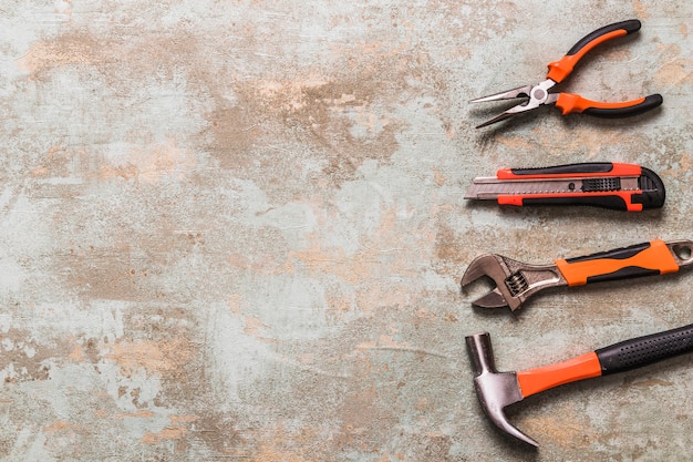 High angle view of various worktools on old wooden background