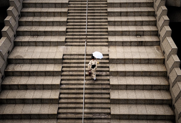 High angle view of woman walking on steps