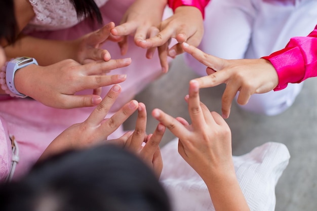 Photo high angle view of women forming star shape with fingers