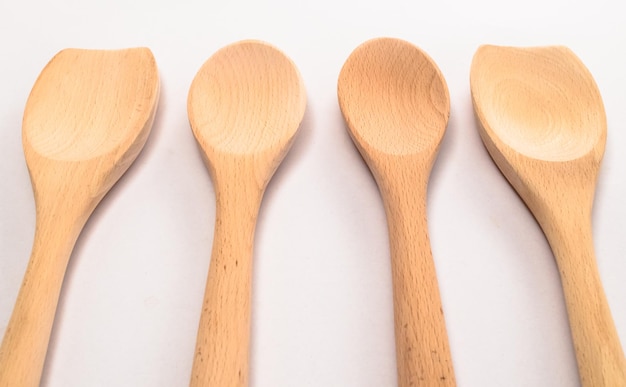 High angle view of wooden spoons on gray background