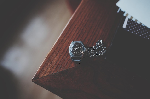 High angle view of wristwatch on table