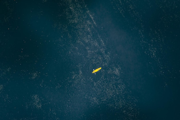 High angle view of yellow kayak floating in the lake