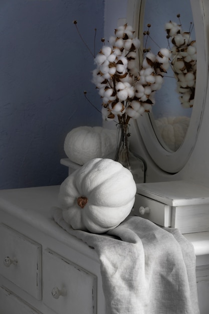 High angle white pumpkins and cotton