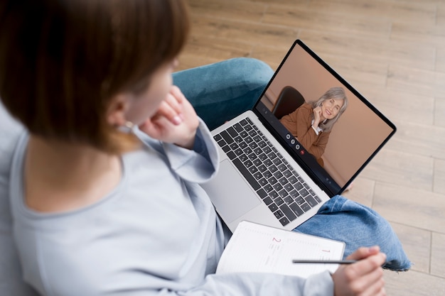 Photo high angle woman making a video call