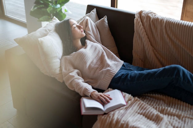 High angle woman sleeping on couch