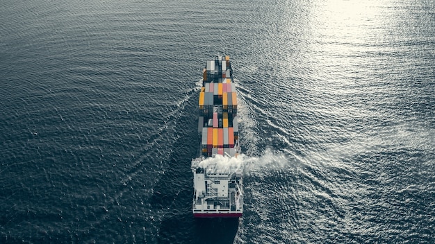 High angled view of container ship sailing in sea