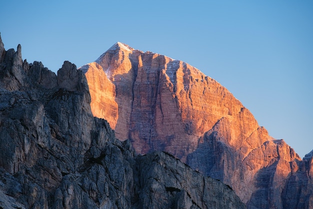 High cliffs during sunset Dolomite Alps Italy Mountains and clear skies View of mountains and cliffs Natural mountain scenery Photography as a backdrop for travel