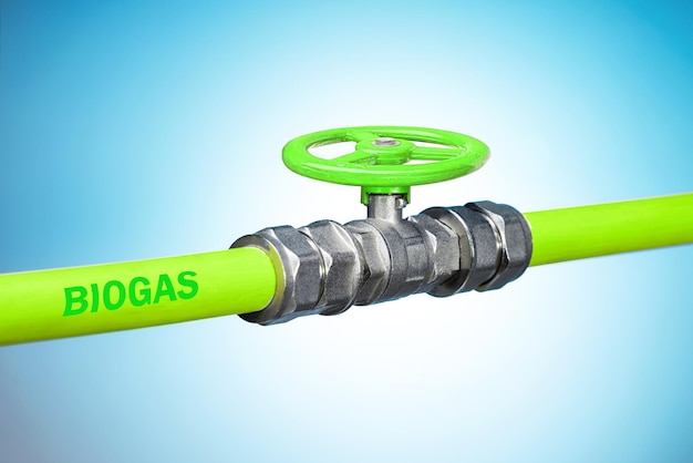 High pressure biogas pipe in the cogeneration plant green pipe with valve for biogas on blue background renewable energy concept