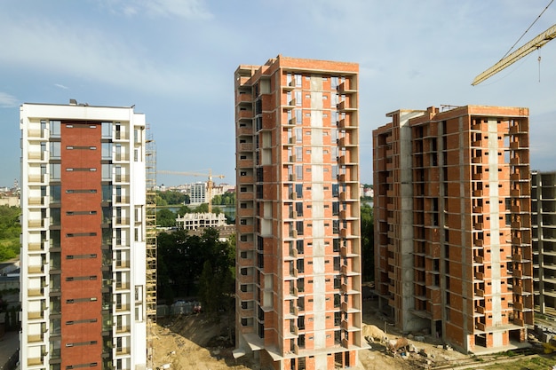 High residential apartment buildings under construction. Real estate development.