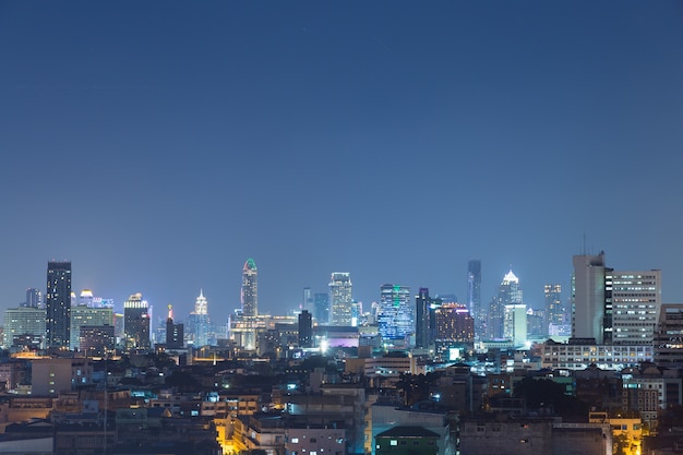 High-rise buildings in downtown Bangkok at night.