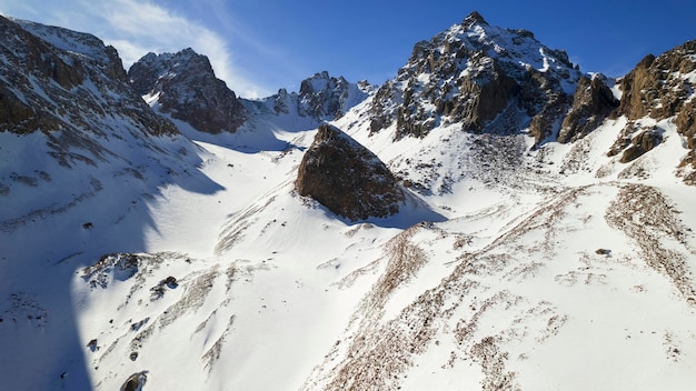 High snow capped mountains among large glaciers