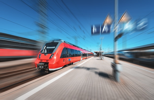 High speed red train on the railway station