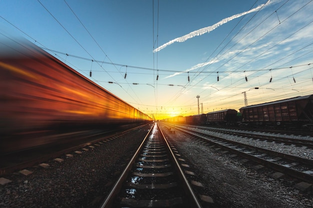 High-speed train moves by rail, delivery of goods by freight train. Train carriages at the station