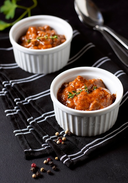 High view winter food stew in bowls and spices