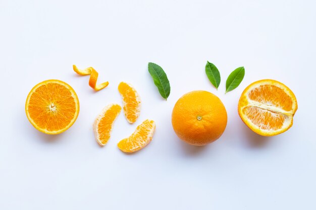 High vitamin C. Fresh orange citrus fruit with leaves isolated on white