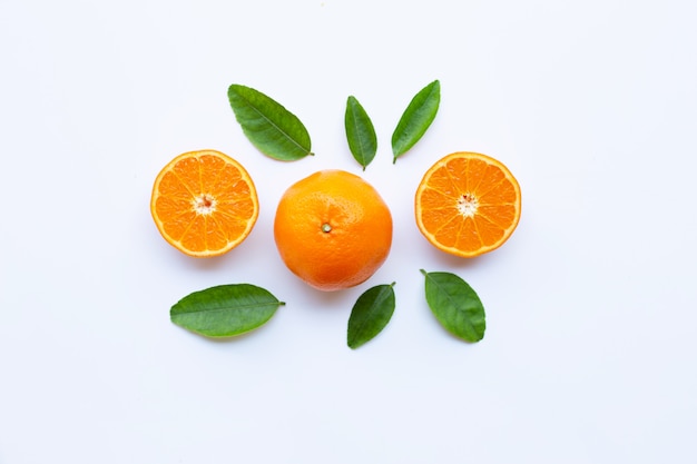 High vitamin C. Fresh orange citrus fruit with leaves isolated on white