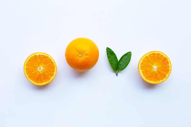 High vitamin C. Fresh orange citrus fruit with leaves isolated on white