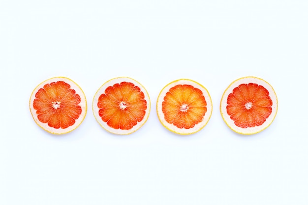 High vitamin C. Juicy grapefruit slices on white background.