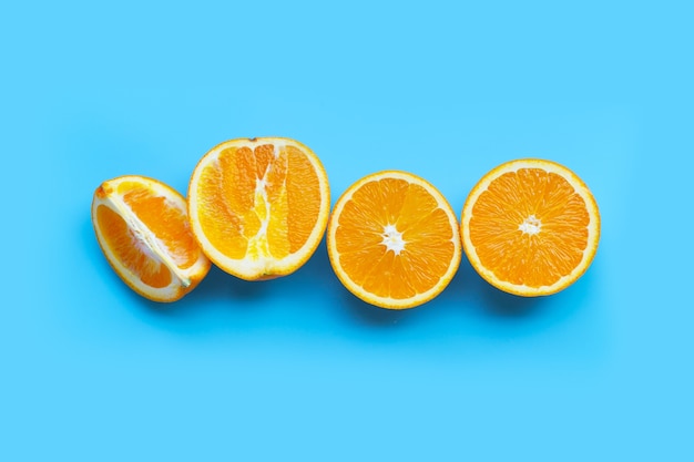 High vitamin C, Juicy and sweet. Fresh orange fruit on blue table. Top view