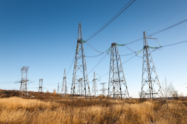 High voltage power lines with electricity pylons