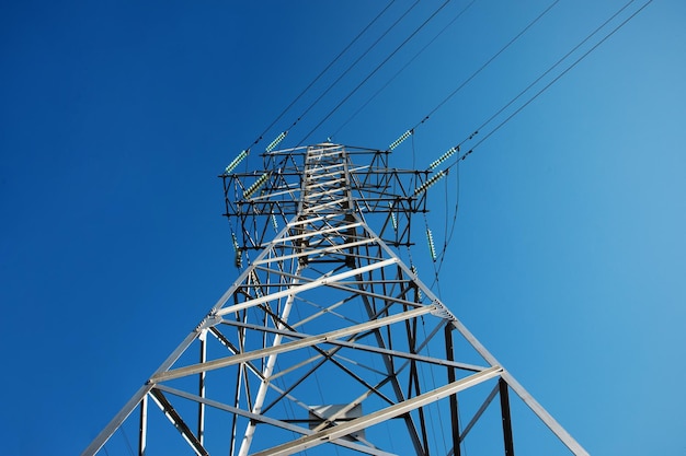 High voltage tower over blue sky electricity crisis