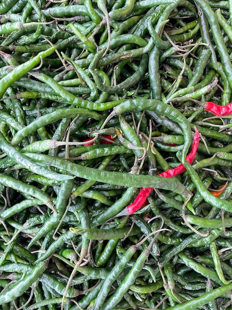 Highquality closeup photo of fresh green Asian chili peppers ready for sale Perfect for culinary