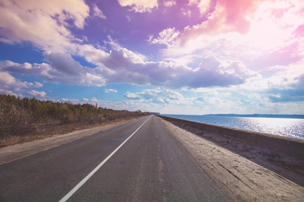 The highway on the dam along the sea Landscape with beautiful evening sky