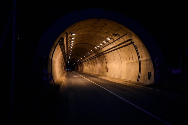 Highway tunnel entrance at night