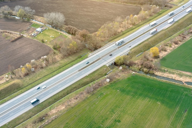 Highway view from above with passing cars truck driving on the highway