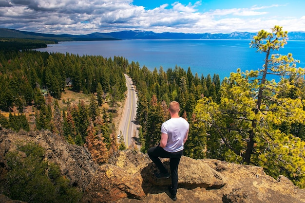 Hiker enjoying the view of lake tahoe from the eagle rock in california