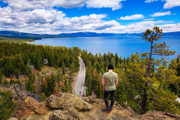 Hiker enjoying the view of lake tahoe from the eagle rock in california