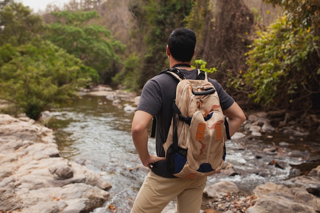 Hiker observing a river