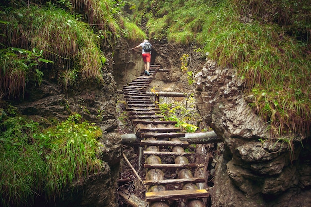 Hiker walking hard way through the canyon