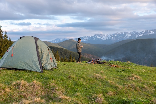 Hiker with equipment spends time hiking in the mountains