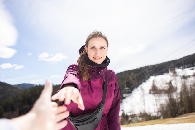 Hiker woman giving a helping hand Hands reaching out to help each other