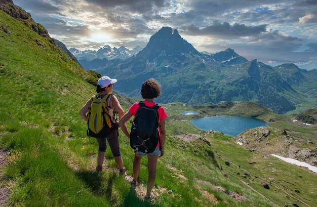 Hiker women in path of Pic du Midi Ossau in the French Pyrenees mountains