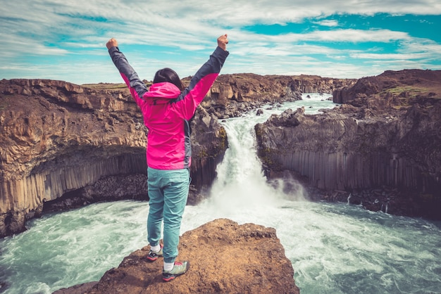 Hiking at Aldeyjarfoss Waterfall in Iceland.