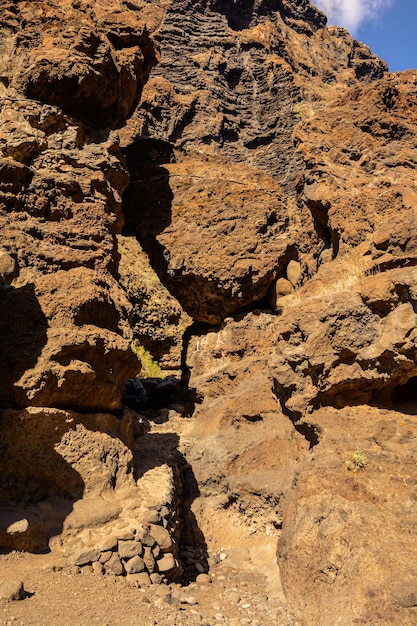 Hiking in Gorge Masca. beautiful path along the gorge to the ocean. Mountains of the island of Tenerife, Canary Island, Spain.