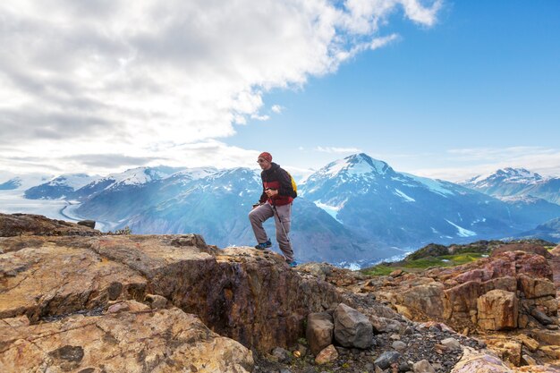 Hiking man in Canadian mountains. Hike is the popular recreation activity in North America. There are a lot of picturesque trails.