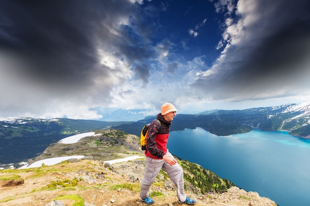 Hiking man in Canadian mountains. Hike is the popular recreation activity in North America. There are a lot of picturesque trails.